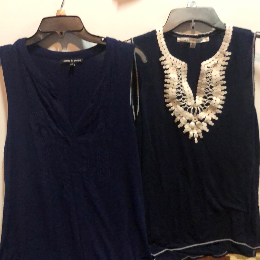 Two sleeveless blue blouses